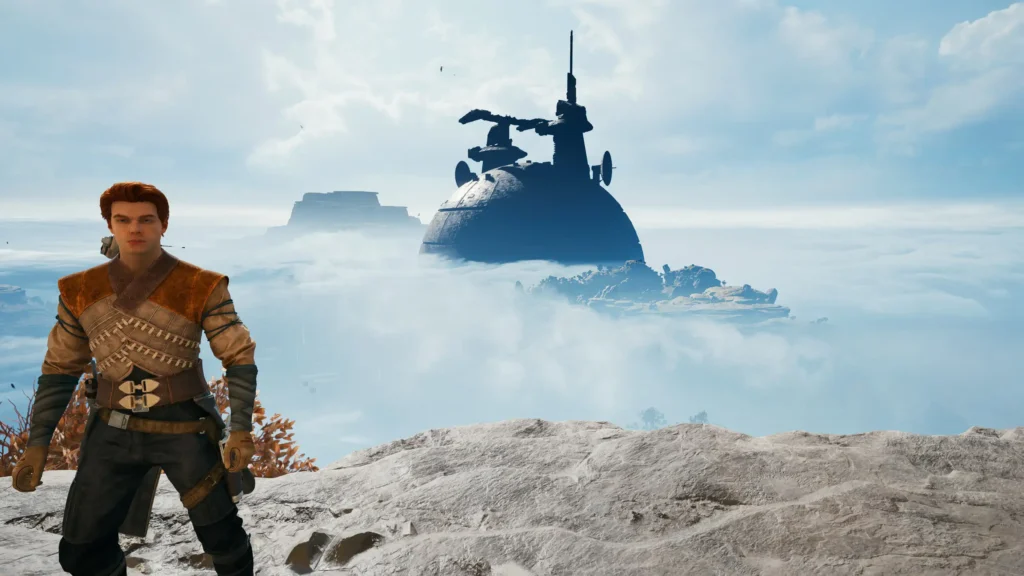 Screenshot aus Star Wars Jedi: Survivor, auf dem im Vordergrund ein männlicher Charakter zu sehen ist, der anscheinend auf einem Berg steht.